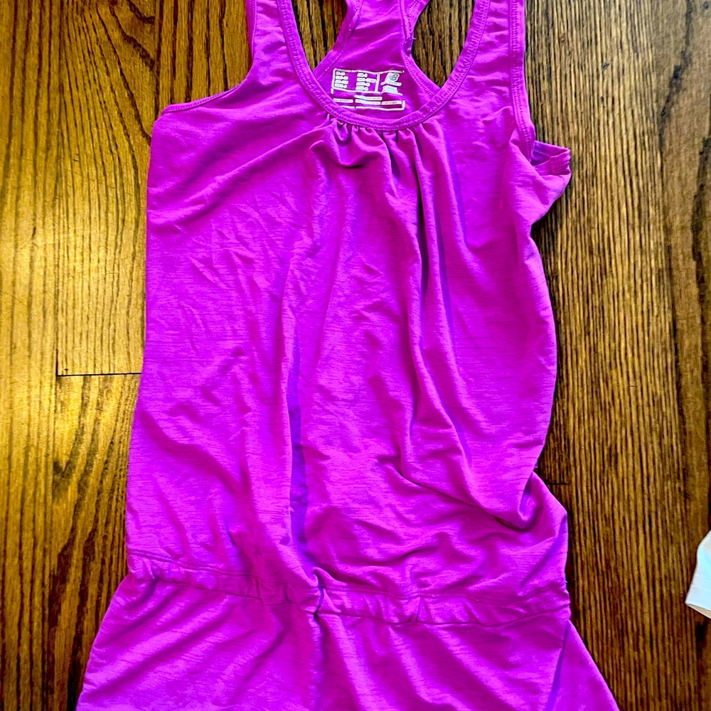 Lightweight New Balance top with light booty coverage!